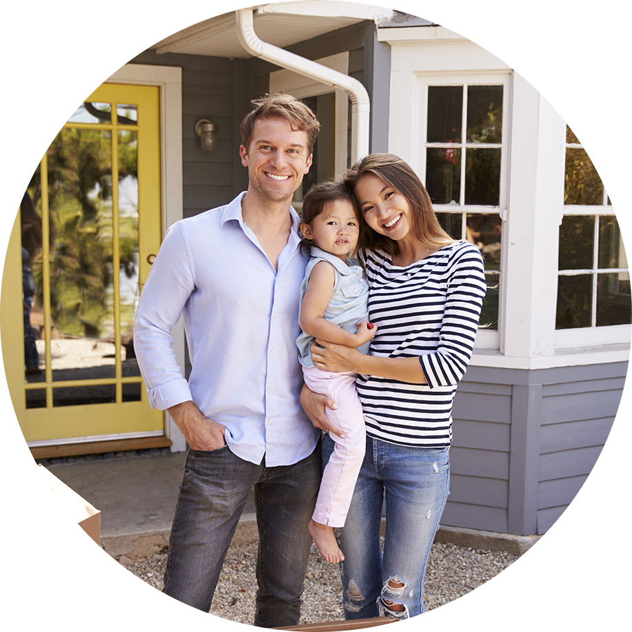 Happy family with second mortgage standing outside up-scale home